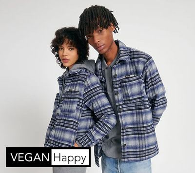 Young couple modelling shirts from VEGAN Happy store.