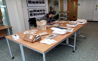 OneKind Policy Officer Kirsty Jenkins looking through the charitys archives at Edinburgh University