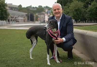 Rescued greyhound Joy with Mark Ruskell MSP.