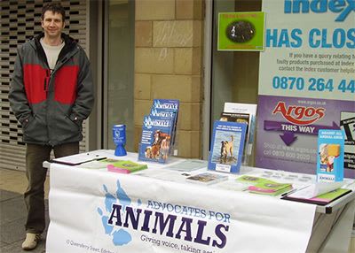 Advocates for Animals volunteer at a stall