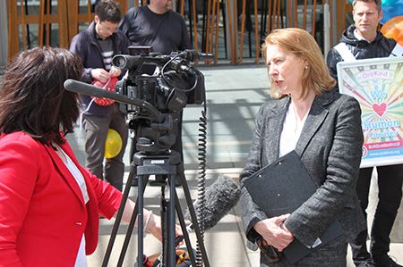 OneKind Policy Officer Libby Anderson speaking to the Press outside Scottish Parliament