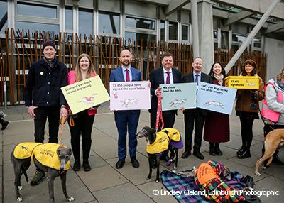 MSPs and Unbound the Greyhound coalition outside Scottish Parliament.